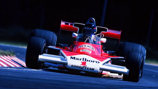 Jame Hunt on his McLaren Formula uno wearing his iconic helmet.