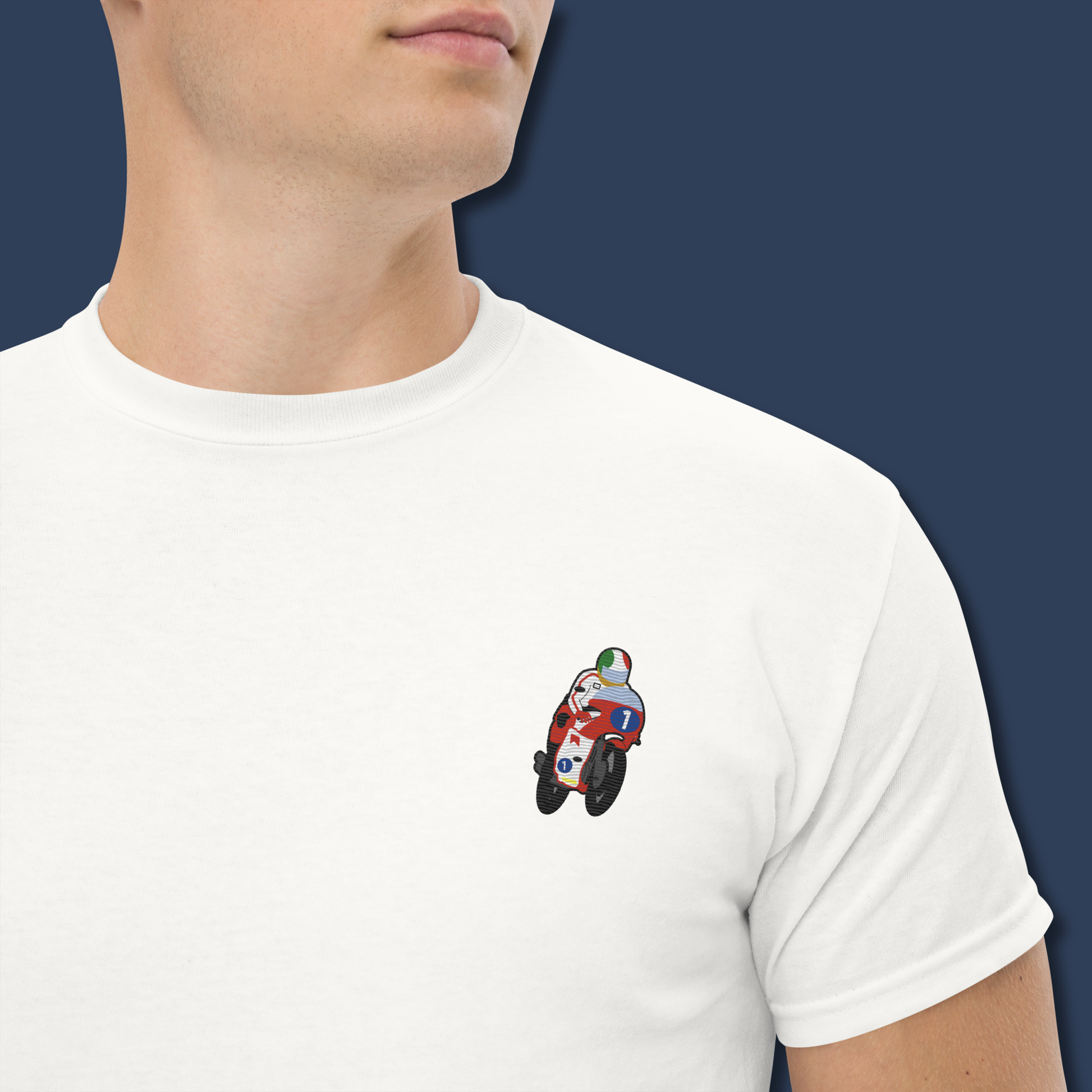Embroidered cotton T-shirt featuring Giacomo Agostini riding his legendary MV Agusta, celebrating the golden era of MotoGP and one of the greatest World Champions in racing history. This short sleeve T-shirt design captures pure speed, style, and heritage. Made from premium cotton, it’s a timeless graphic tee and perfect Tshirt gift for him with free shipping included. Honor Agostini’s racing legacy and Italian excellence. Shop now and wear motorcycle history!