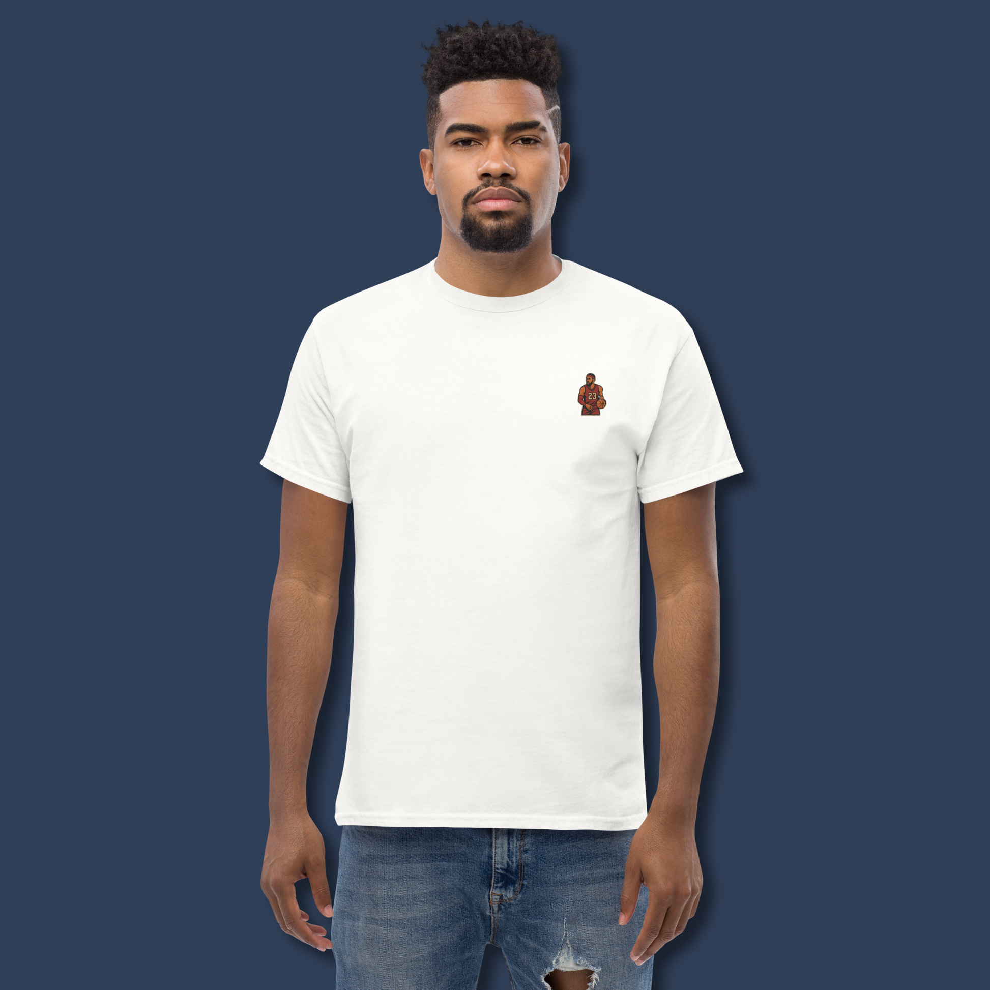 Men's (or Unisex) white cotton t-shirt featuring a small, vintage-inspired embroidered patch/graphic of NBA basketball player LeBron James in his L.A. Lakers jersey (number 23). Graphic tees, gift for him, retro style, Strength and Courage brand.