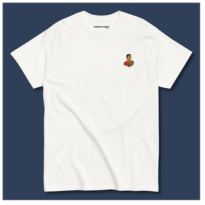 White cotton short sleeve t-shirt featuring a small, minimalist embroidered graphic design of tennis player Novak Djokovic in a red shirt holding a racket.