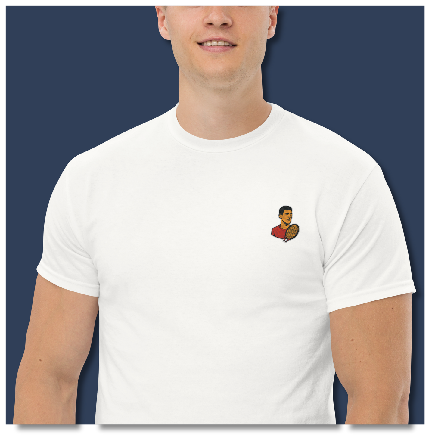 White cotton short sleeve t-shirt featuring a small, minimalist embroidered graphic design of tennis player Novak Djokovic in a red shirt holding a racket.