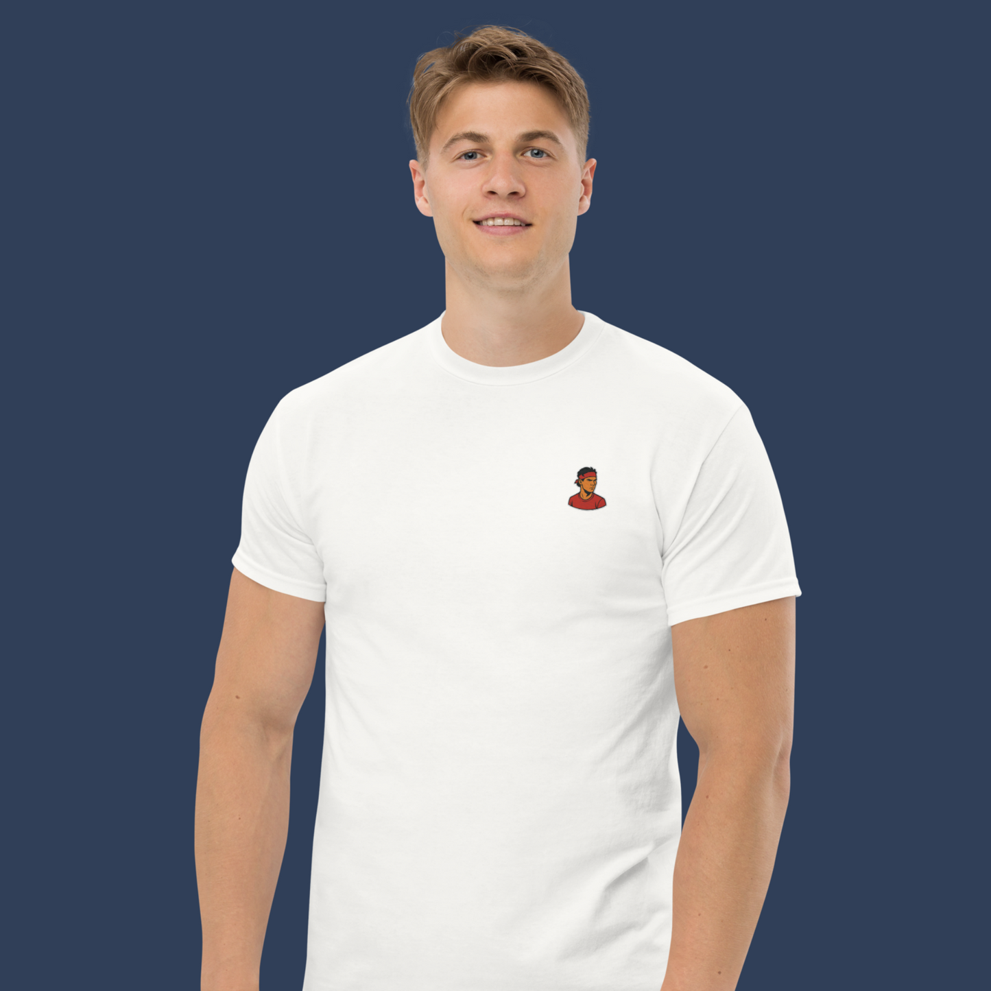 White premium cotton short sleeve t-shirt featuring a small, detailed embroidery of tennis legend Rafael Nadal in his signature pose.