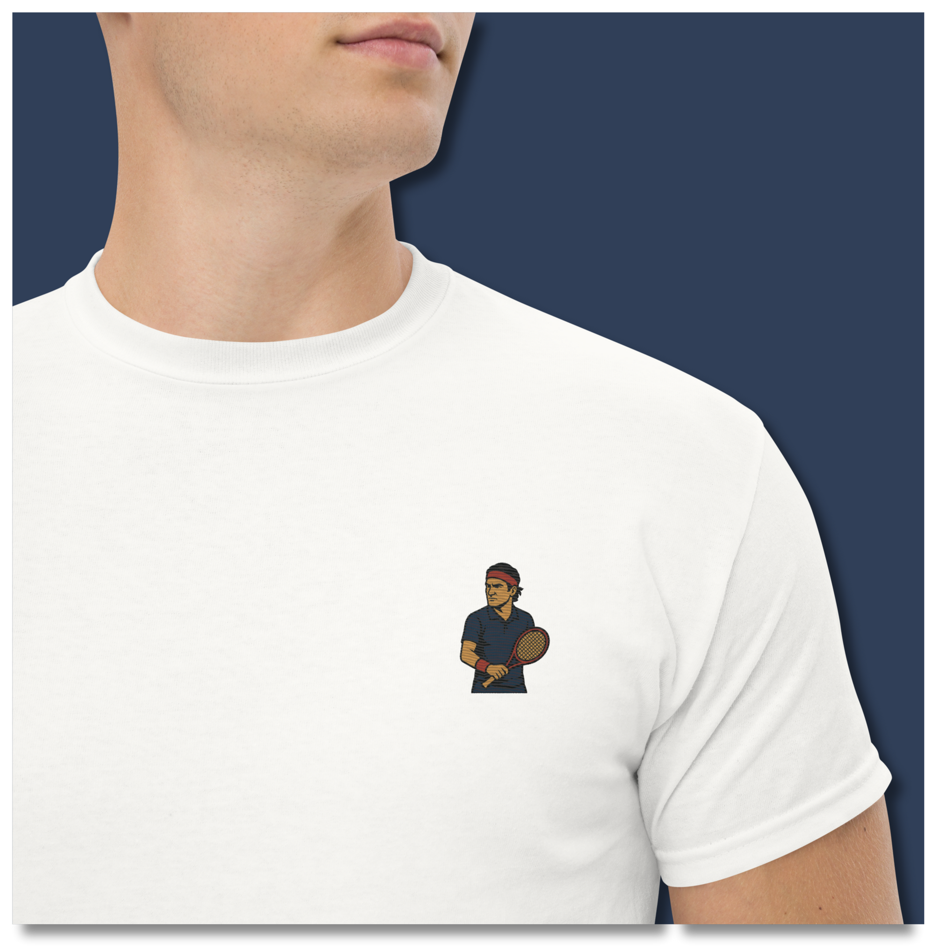 Premium white cotton short sleeve t-shirt featuring a small embroidered graphic of Roger Federer in a navy tennis kit and his iconic red headband.