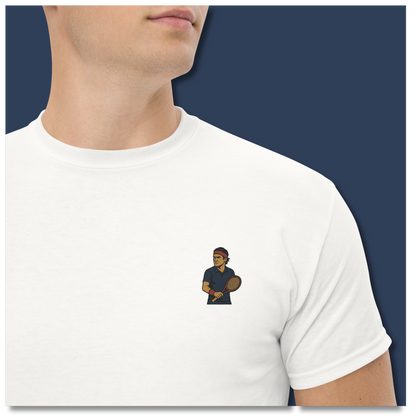 Premium white cotton short sleeve t-shirt featuring a small embroidered graphic of Roger Federer in a navy tennis kit and his iconic red headband.