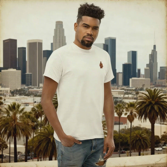 Men's (or Unisex) white cotton t-shirt featuring a small, vintage-inspired embroidered patch/graphic of NBA basketball player LeBron James in his L.A. Lakers jersey (number 23). Graphic tees, gift for him, retro style, Strength and Courage brand.