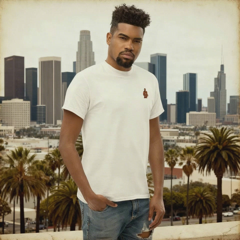 Men's (or Unisex) white cotton t-shirt featuring a small, vintage-inspired embroidered patch/graphic of NBA basketball player LeBron James in his L.A. Lakers jersey (number 23). Graphic tees, gift for him, retro style, Strength and Courage brand.