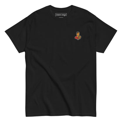 Black cotton short sleeve t-shirt featuring a small, minimalist embroidered graphic design of tennis player Novak Djokovic in a red shirt holding a racket.