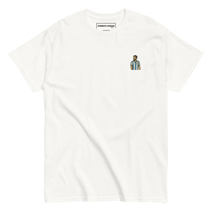 Men's (or Unisex) white cotton graphic tee featuring a small, retro-inspired embroidered patch/graphic of football player Lionel Messi in the Argentina (AFA) 'Albiceleste' jersey. GOAT, soccer, football, vintage style, Strength and Courage brand.